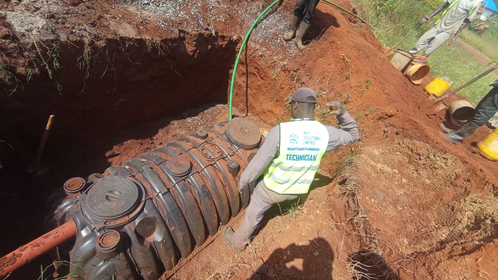 MEP Solutions technician installing underground tank at Sirisia