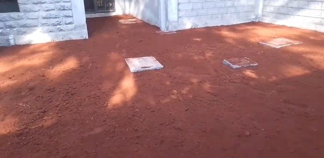 External drainage covers and backfilled ground at the Karen residence